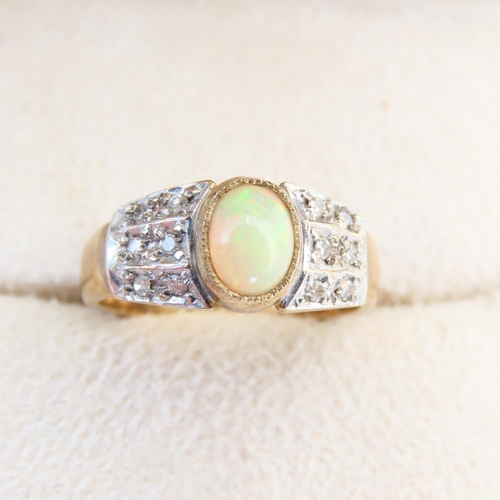 122 - Opal and Diamond Ring Mounted on 9 Carat Yellow Gold Band Size N