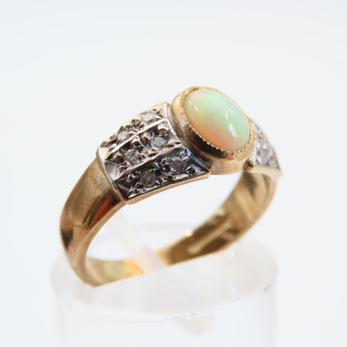 122 - Opal and Diamond Ring Mounted on 9 Carat Yellow Gold Band Size N