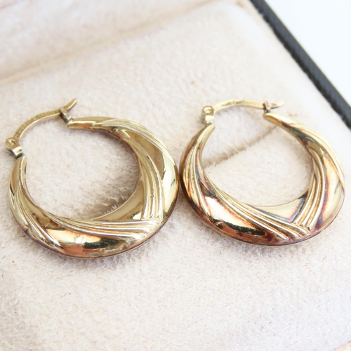 123 - Pair of 9 Carat Yellow Gold Ladies Hoop Earrings Incised Detailing Each Approximately 2cm Diameter