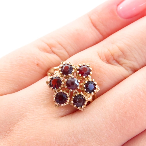 61 - Red Garnet Six Stone Cluster Ring Mounted on 9 Carat Yellow Gold Band Size Q