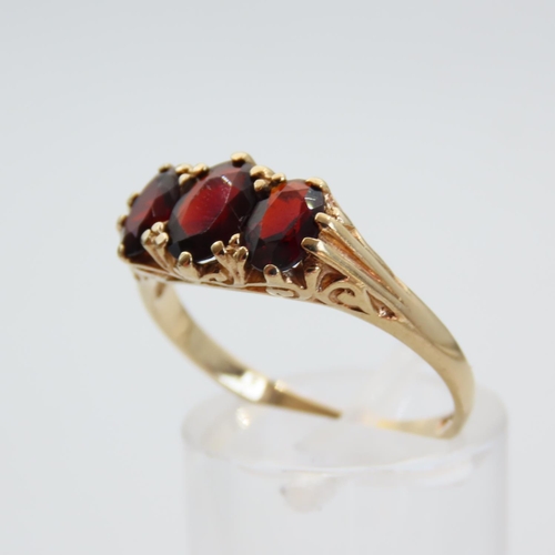 64 - Red Garnet Three Stone Ring Mounted on 9 Carat Yellow Gold Band Size R