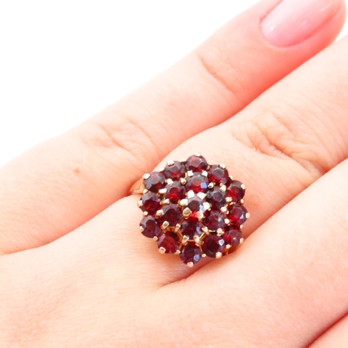 65 - Garnet Set Cluster Ring Mounted on 9 Carat Yellow Gold Band Size P