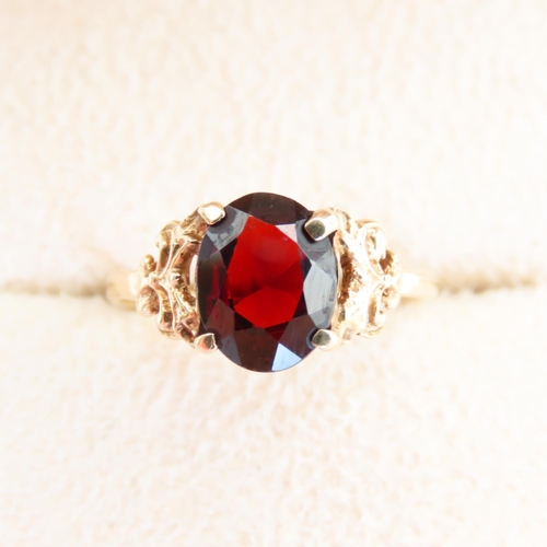 68 - Red Garnet Centerstone Ring Four Claw Set Mounted on 9 Carat Yellow Gold Band Size L