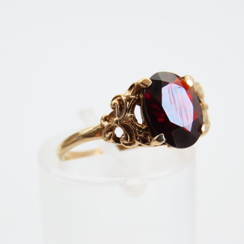 68 - Red Garnet Centerstone Ring Four Claw Set Mounted on 9 Carat Yellow Gold Band Size L