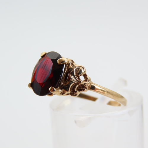 68 - Red Garnet Centerstone Ring Four Claw Set Mounted on 9 Carat Yellow Gold Band Size L