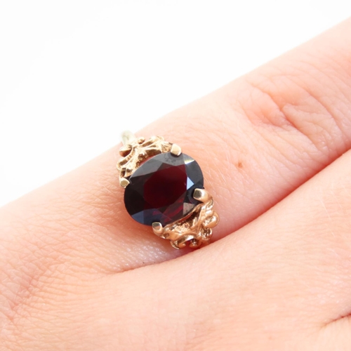 68 - Red Garnet Centerstone Ring Four Claw Set Mounted on 9 Carat Yellow Gold Band Size L