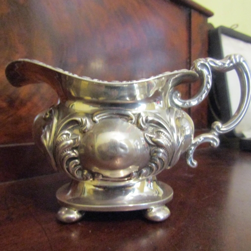 543 - Rocco Form Silver Bachelors Milk Jug Shaped Form Handle Above Bun Supports Attractively Detailed