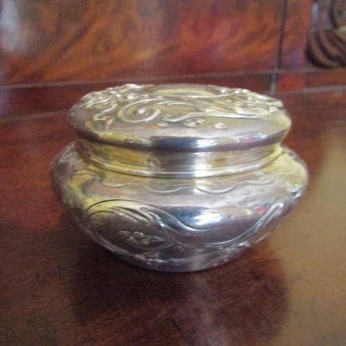 549 - Silver Desk Jar Shaped Form Embossed Detailing Attractive Motifs Approximately 3 Inches Diameter