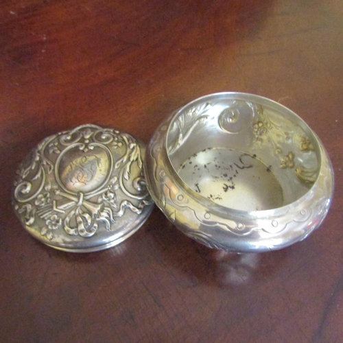 549 - Silver Desk Jar Shaped Form Embossed Detailing Attractive Motifs Approximately 3 Inches Diameter