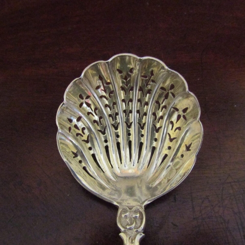 551 - Silver Sugar Caster Spoon Figural Decoration Attractively Detailed Approximately 6 Inches Long