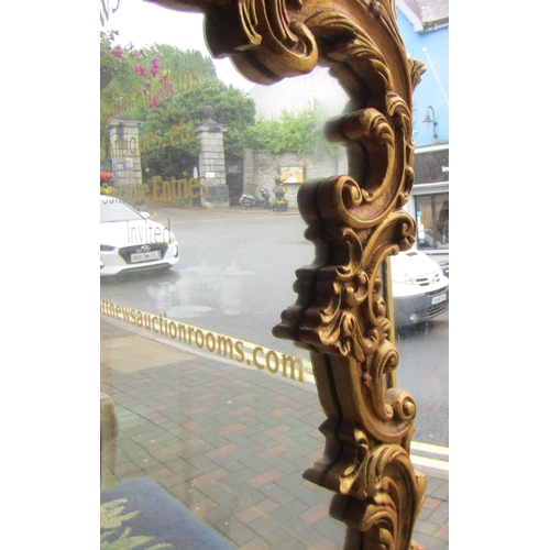 69 - Carved Giltwood Cartouche Form Wall Mirror Approximately 3ft 6 Inches High x 2ft 6 Inches Wide