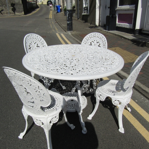 587 - Cast Metal Garden or Conservatory Table with Four Matching Chairs Table Approximately 3ft Diameter