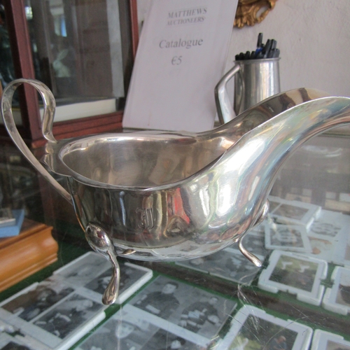 605 - Large Silver Victorian Sauceboat on Shaped Support Flying C Scroll Handle