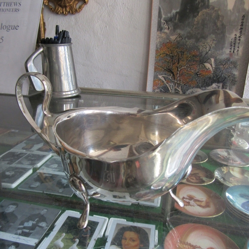 605 - Large Silver Victorian Sauceboat on Shaped Support Flying C Scroll Handle