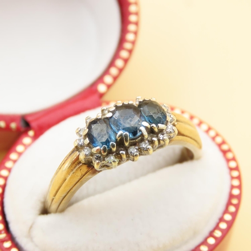 100 - Sapphire and Diamond Three Stone Cluster Ring Mounted on 9 Carat Yellow Gold Band Ring Size P