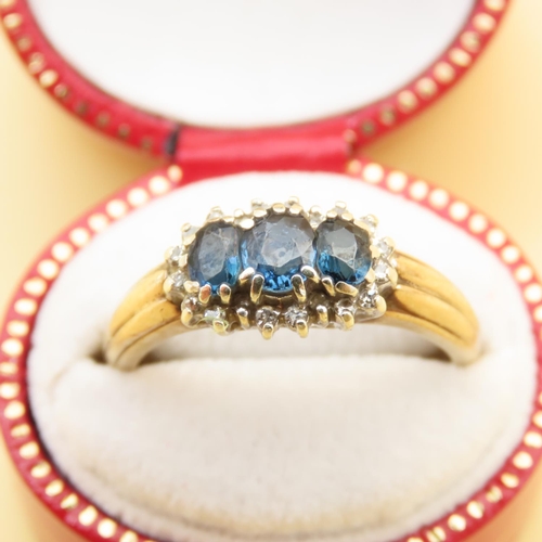 100 - Sapphire and Diamond Three Stone Cluster Ring Mounted on 9 Carat Yellow Gold Band Ring Size P