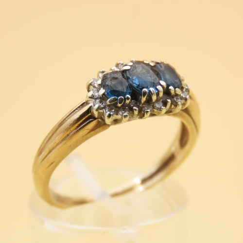 100 - Sapphire and Diamond Three Stone Cluster Ring Mounted on 9 Carat Yellow Gold Band Ring Size P