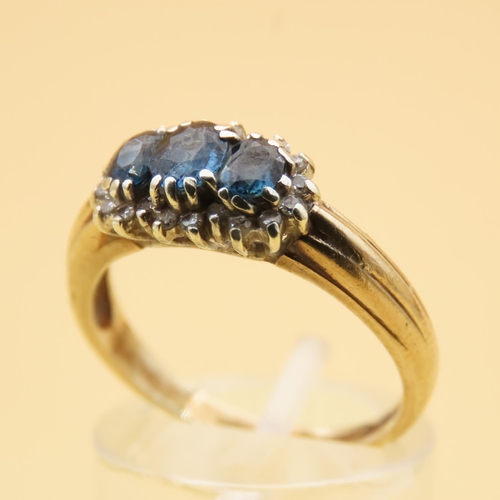 100 - Sapphire and Diamond Three Stone Cluster Ring Mounted on 9 Carat Yellow Gold Band Ring Size P