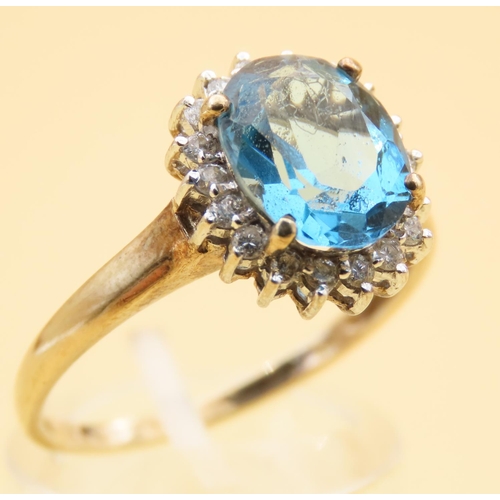 101 - Blue Topaz and Diamond Cluster Ring Mounted on 9 Carat Yellow Gold Band Ring Size U