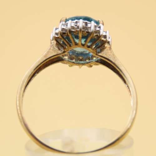 101 - Blue Topaz and Diamond Cluster Ring Mounted on 9 Carat Yellow Gold Band Ring Size U