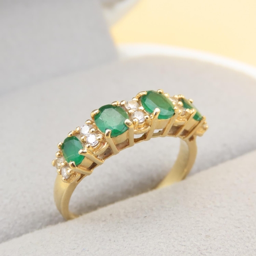 110 - Emerald and Diamond Four Stone Ring Mounted on 18 Carat Yellow Gold Band Ring Size O and a Half