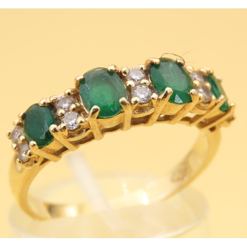 110 - Emerald and Diamond Four Stone Ring Mounted on 18 Carat Yellow Gold Band Ring Size O and a Half