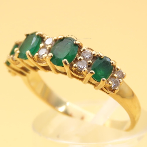 110 - Emerald and Diamond Four Stone Ring Mounted on 18 Carat Yellow Gold Band Ring Size O and a Half