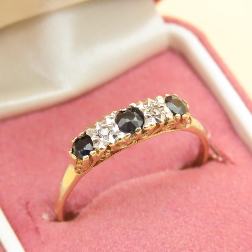 111 - Sapphire and Diamond Three Stone Ring Mounted on 9 Carat Yellow Gold Band Ring Size T and a Half