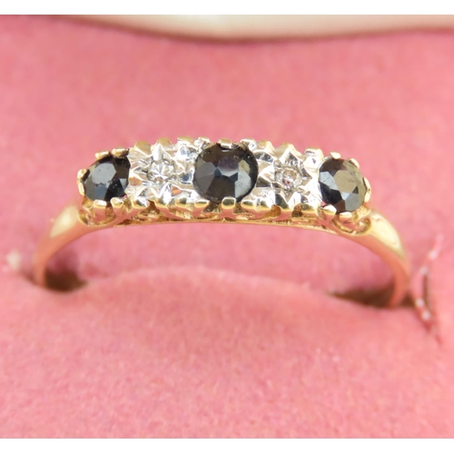 111 - Sapphire and Diamond Three Stone Ring Mounted on 9 Carat Yellow Gold Band Ring Size T and a Half