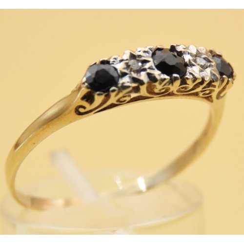 111 - Sapphire and Diamond Three Stone Ring Mounted on 9 Carat Yellow Gold Band Ring Size T and a Half