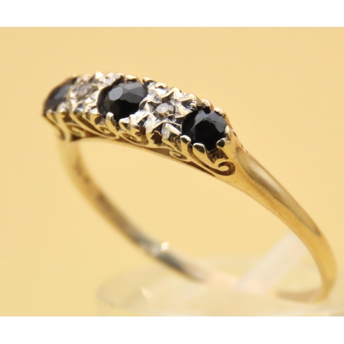 111 - Sapphire and Diamond Three Stone Ring Mounted on 9 Carat Yellow Gold Band Ring Size T and a Half