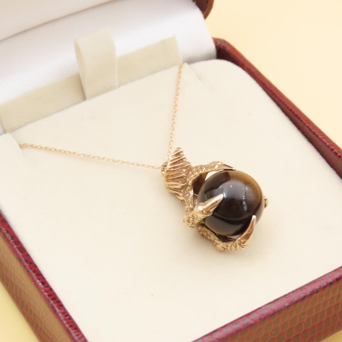 120 - 9 Carat Yellow Gold Tigers Eye Pendant Dragon Claw Set Mounted on 9 Carat Yellow Gold Chain Pendant ... 