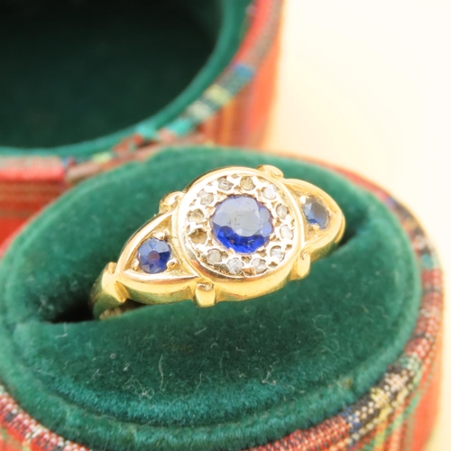 125 - Sapphire and Diamond Three Stone Ring Mounted on 18 Carat Yellow Gold Band Ring Size L