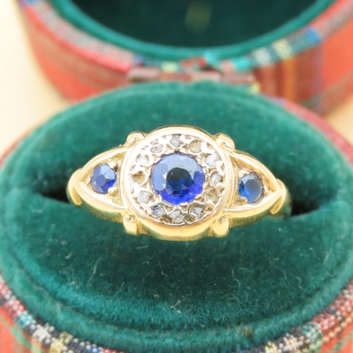 125 - Sapphire and Diamond Three Stone Ring Mounted on 18 Carat Yellow Gold Band Ring Size L