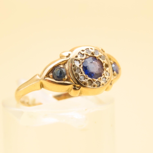 125 - Sapphire and Diamond Three Stone Ring Mounted on 18 Carat Yellow Gold Band Ring Size L