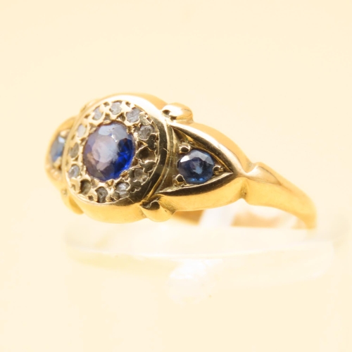 125 - Sapphire and Diamond Three Stone Ring Mounted on 18 Carat Yellow Gold Band Ring Size L