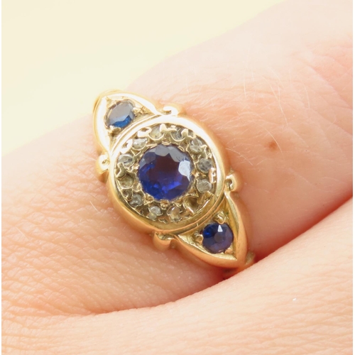 125 - Sapphire and Diamond Three Stone Ring Mounted on 18 Carat Yellow Gold Band Ring Size L