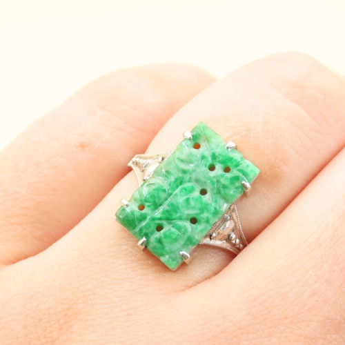40 - Carved Jade Panel Set Ring Mounted on 9 Carat White Gold Band Diamond Set Shoulders Ring Size N and ... 