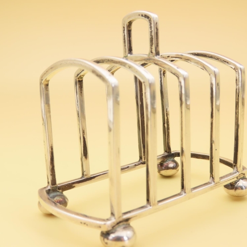 445 - Silver Bachelor Four Slice Toast Rack 8cm Long x 6cm High