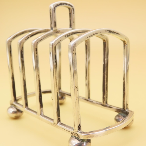 445 - Silver Bachelor Four Slice Toast Rack 8cm Long x 6cm High