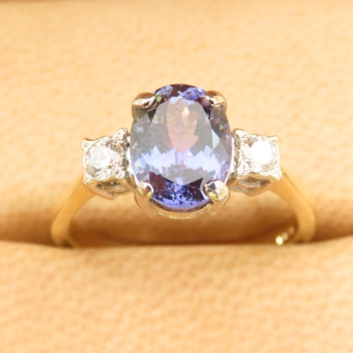 467 - Ladies Tanzanite Centerstone Ring Further Decorated with Diamonds to Shoulders Mounted on 18 Carat Y... 