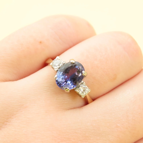 467 - Ladies Tanzanite Centerstone Ring Further Decorated with Diamonds to Shoulders Mounted on 18 Carat Y... 