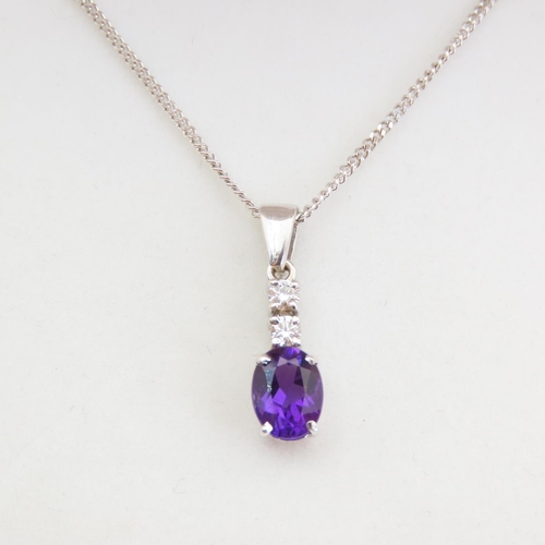 61 - 9 Carat White Gold Tanzanite Oval Cut Four Claw Set Twin Diamond Pendant Mounted on 9 Carat Yellow G... 