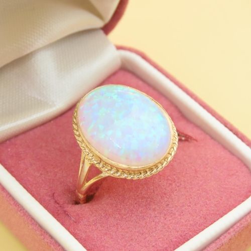 62 - Opal Centerstone Ring Mounted on 9 Carat Yellow Gold Band Ring Size P