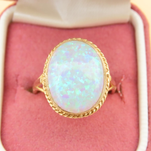 62 - Opal Centerstone Ring Mounted on 9 Carat Yellow Gold Band Ring Size P