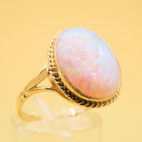 62 - Opal Centerstone Ring Mounted on 9 Carat Yellow Gold Band Ring Size P