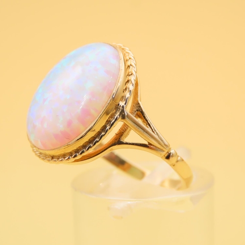 62 - Opal Centerstone Ring Mounted on 9 Carat Yellow Gold Band Ring Size P