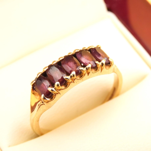 79 - Amethyst Five Stone Ring Emerald Cut Attractively Detailed Mounted on 9 Carat Yellow Gold Band Ring ... 