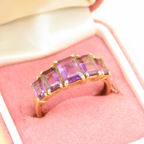 80 - Amethyst Five Stone Ring Graduated Form Each Stone Four Claw Set Mounted on 9 Carat Yellow Gold Band... 