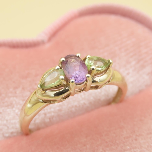 86 - Green and Purple Amethyst Three Stone Ring Mounted on 9 Carat Yellow Gold Band Ring Size R